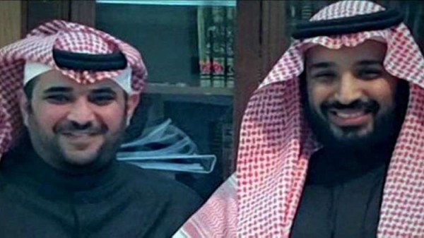 Saud al-Qahtani to the left next to Mohammad bin Salman